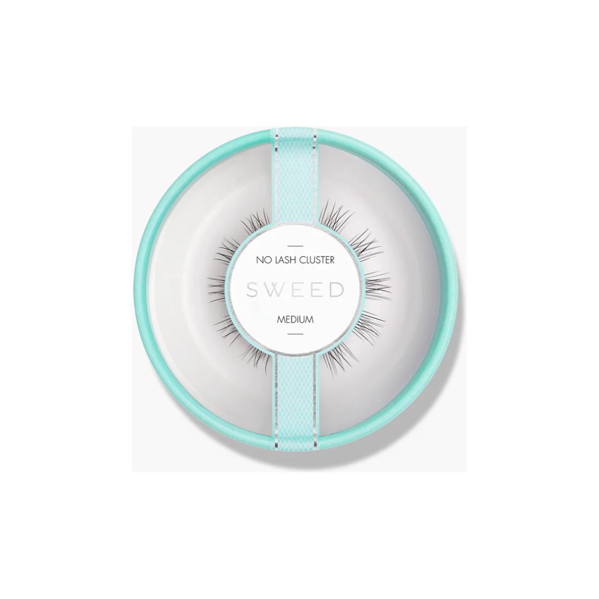 A pair of medium-sized false eyelashes presented on a circular background designed to resemble a dish.