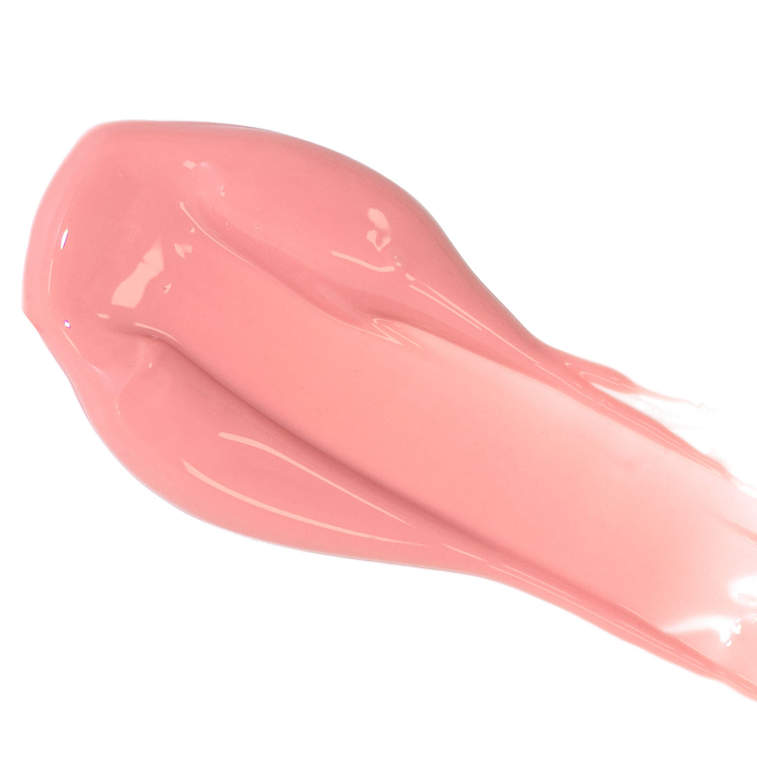 A smear of pink glossy lipstick on a white background.